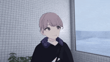a girl in a black hoodie with the letter z on it stands in front of a window