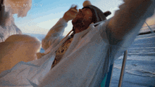 a man sitting in a chair with his arms outstretched and the words hailmary on the bottom