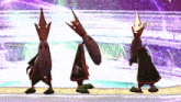 three cartoon characters with crowns on their heads are standing next to each other on a stage