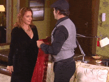 a man and a woman are standing next to each other
