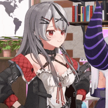 a girl with gray hair and red eyes stands in front of a bookshelf