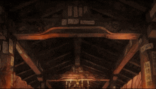 candles are lit up in a dark room with chinese writing on the ceiling