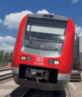 a red and silver train with the letters db on the front