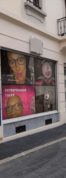 a window with a picture of a woman and the words entrepreneur talks