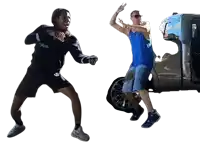 a man in a blue tank top is jumping in front of a truck