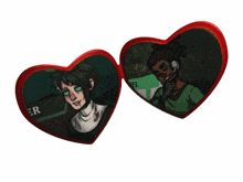 a couple of heart shaped buttons with the word gr on them