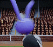 a purple bunny is flying in the air in front of a crowd of skeletons