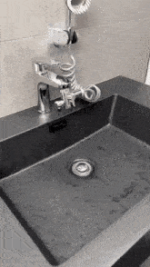 a bathroom sink with a faucet and shower head