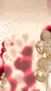 a bunch of gold and white balloons with confetti falling