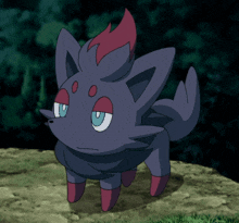 a small pokemon with a red tail and blue eyes