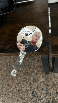 a badge holder with a picture of a doctor on it that says " oh have seen you twice "