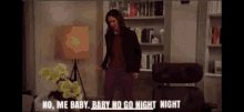 a woman standing in a living room with the words no me baby baby no go night night