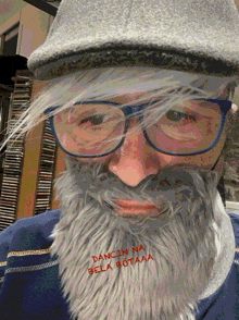 a man with glasses and a beard has the words " dancin na gela botaaa " written on his face