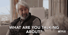 a man sitting on a couch with the words what are you talking about