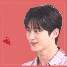 a close up of a young man 's face with a red heart in the background