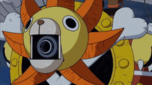 a yellow and orange cartoon sun with a camera in its mouth