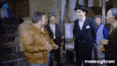 a group of men are standing next to each other in a room .