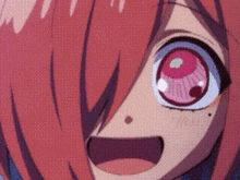 a close up of a person 's face with a surprised look on her face .