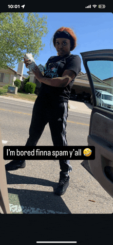 a girl is holding a bunch of money and says i 'm bored finna spam y ' all