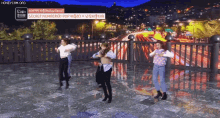 a group of women are dancing on a balcony with a sign that says secret number
