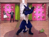 a person in a lucario costume dancing on a dance floor