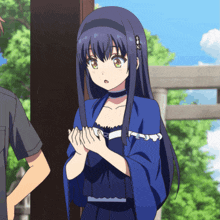 a girl with long blue hair is standing next to a man in a black shirt