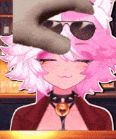 a cartoon girl with pink hair and sunglasses is being touched by a cat