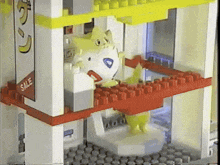 a toy store has a sign that says sale on it
