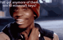 a man wearing a red beanie is smiling with the words yall got anymore of them win 10 minecraft keys