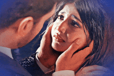 a man is touching a woman 's face with a blue background that says rukaarcreations