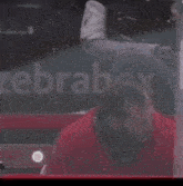 a man in a red jersey with the number 9 on it