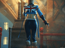 a woman in a british flag jacket is walking down a set of stairs