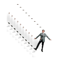 a man in a suit and tie is walking up a set of stairs