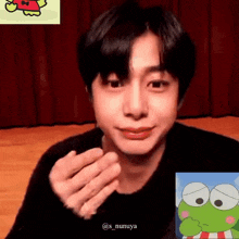 a close up of a person 's face with a picture of a frog behind them .
