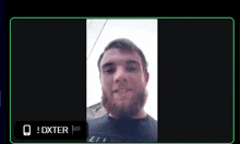 a man with a beard is on a video call with the name dxter at the bottom