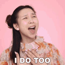 a woman says i do too with her hands on her chest