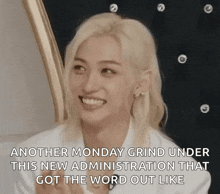a woman with blonde hair is smiling and saying `` another monday grind under this new administration that got the word out like `` .