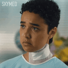 a woman with a bandage around her neck has the word skymed on the bottom