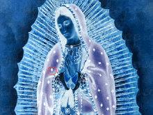 a blue and white painting of the virgin mary with a red circle around her chest