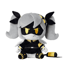 a stuffed animal with a yellow stripe on its feet is covered in dirt