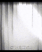 a pixelated image of a white curtain with the words @useinkerim on the bottom