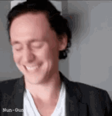 Tom Hiddleston Loki GIF - Tom Hiddleston Loki Laughing GIFs