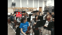 a girl wearing a blue shirt that says bob smith on it is playing violin in an orchestra