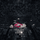a white cube with a red circle on it is floating in a dark room