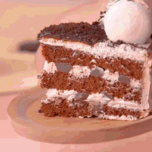 a close up of a slice of cake on a wooden cutting board
