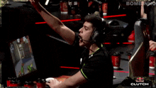 a man wearing headphones is playing a video game sponsored by redbull