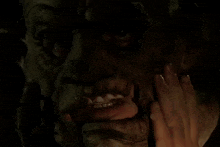 a close up of a person 's face with a very large mouth