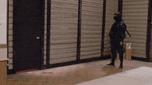 a ninja is standing in a hallway with a sword