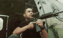 Carlos Madrigal Holding A Machine Gun GIF - Carlos Madrigal Holding A Machine Gun Wilmer Valderama GIFs