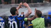 a soccer player with the number 30 on his jersey is celebrating